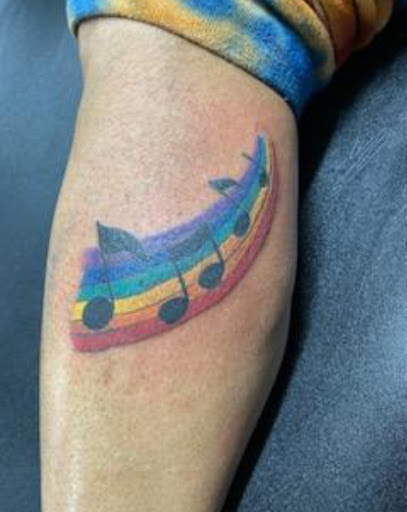 Explore women's lower back tattoo ideas, creative tattoo ideas in Washington, available at Moore-Stone Ink