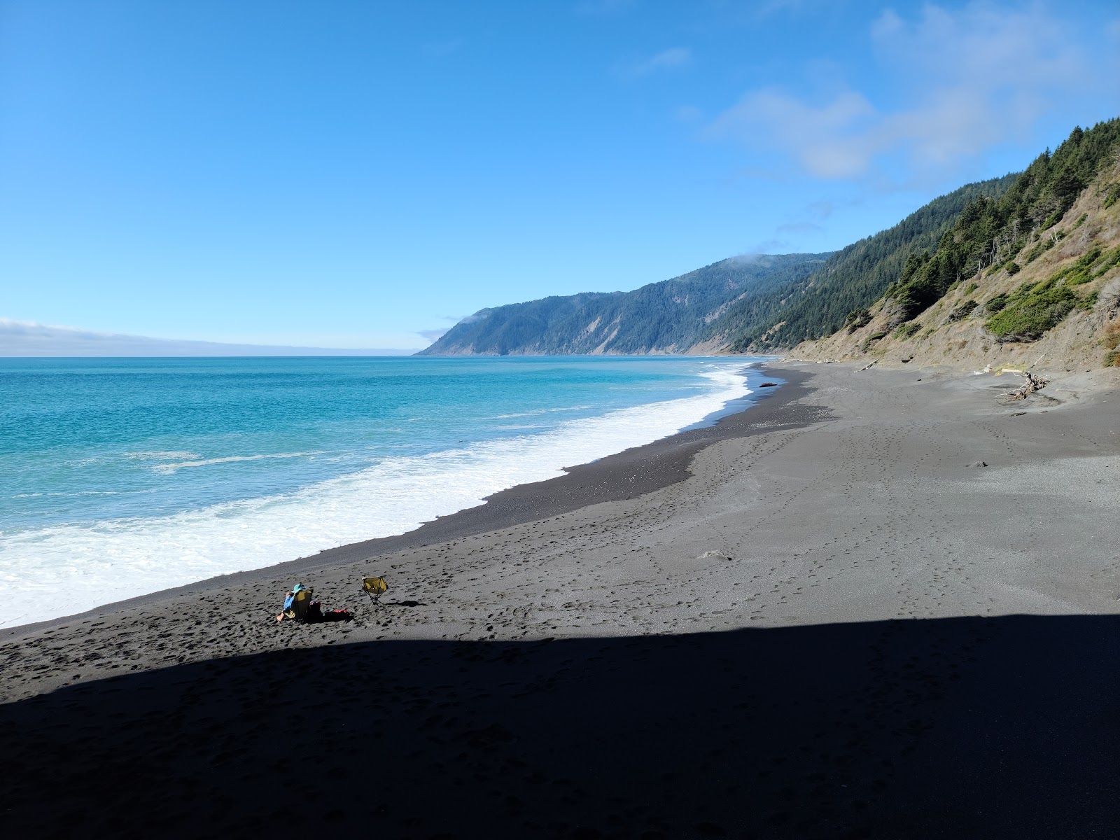 Photo of Black Sands Beach with gray fine pebble surface