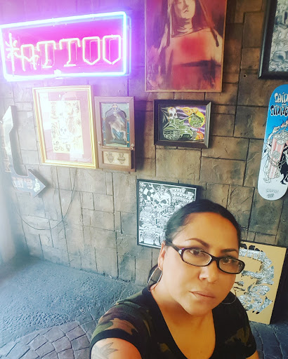 Explore rose tattoo ideas for guys, creative tattoo ideas in Garden Grove, available at Saints & Sinners Tattoo