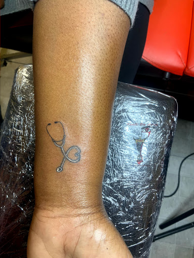 Explore teaching tattoo ideas, creative tattoo ideas in Charlotte, available at BNI-Tattoos