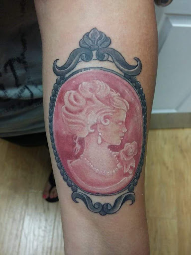 Explore opium tattoo ideas, creative tattoo ideas in Powell, available at Against All Odds Tattoos and Piercings