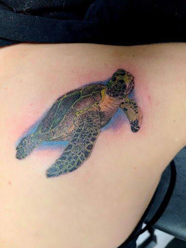 Explore lily flower tattoo ideas, creative tattoo ideas in Pahrump, available at Social Suicide Tattoos