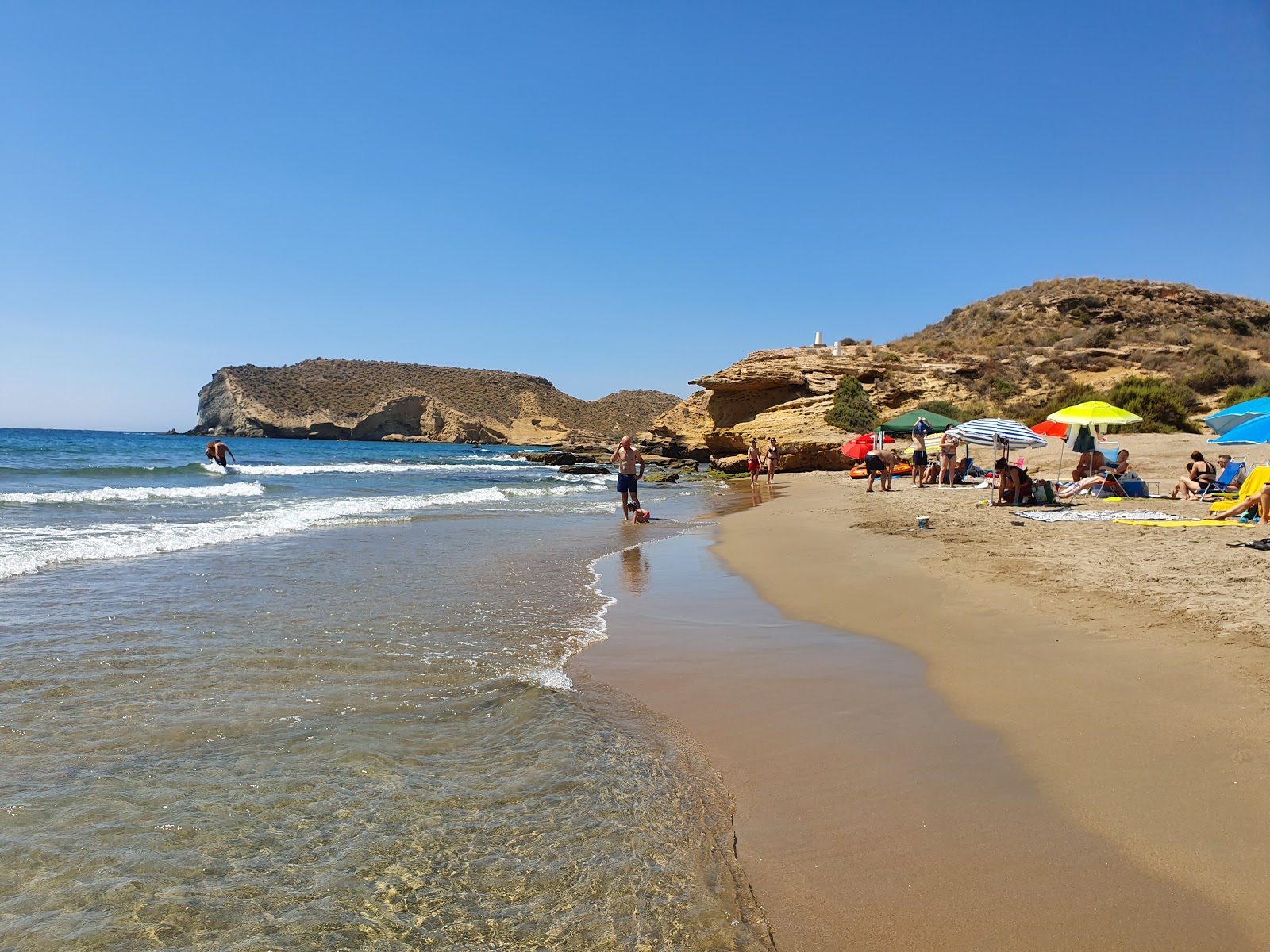 Playa de la Higuerica'in fotoğrafı küçük koy ile birlikte