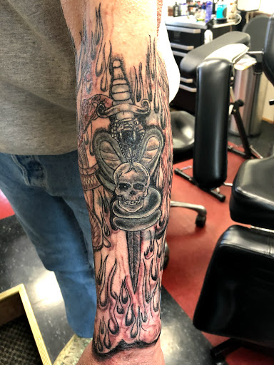 Explore medieval tattoo ideas, creative tattoo ideas in Charlottesville, available at Mystic Tattoo and Body Piercing