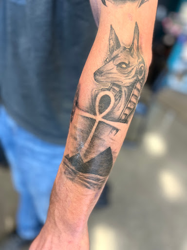 Explore floral hand tattoo ideas, creative tattoo ideas in Oswego, available at Saturn Tattoo