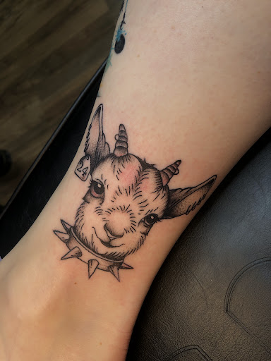 Explore feather tattoo ideas for men, creative tattoo ideas in North Tonawanda, available at Dark Side Ink Tattoo Studio