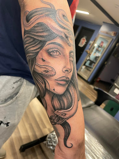 Explore tattoo name cover up ideas on wrist, creative tattoo ideas in Albany, available at Purgatory Tattoo Co.