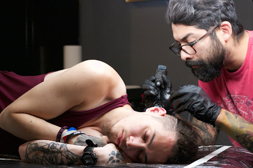 Explore joker card tattoo ideas, creative tattoo ideas in Bronx, available at Asylum Tattoo Studio