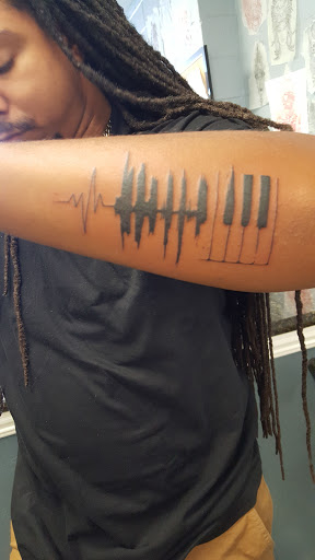 Explore bird tattoo ideas for men, creative tattoo ideas in Concord, available at Silver Needle Studios