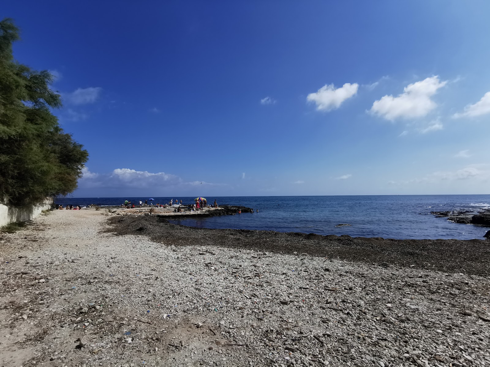 Φωτογραφία του Libera blue wings beach με μικροί και πολλοί κόλποι