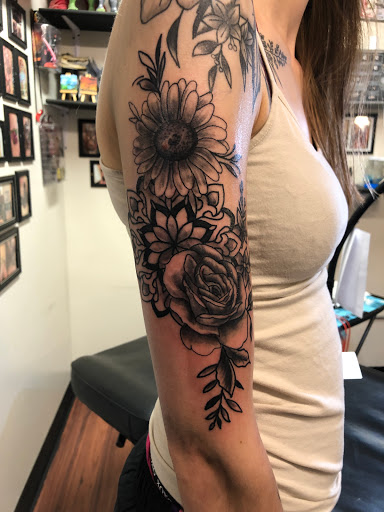 Explore daughter sleeve tattoo ideas, creative tattoo ideas in Alamosa, available at The Shop Tattoo & Comics