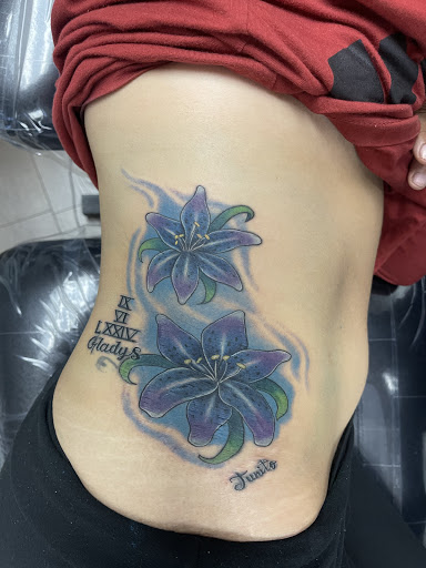Explore upper back tattoo ideas, creative tattoo ideas in Springfield, available at Red Tip Tattoos