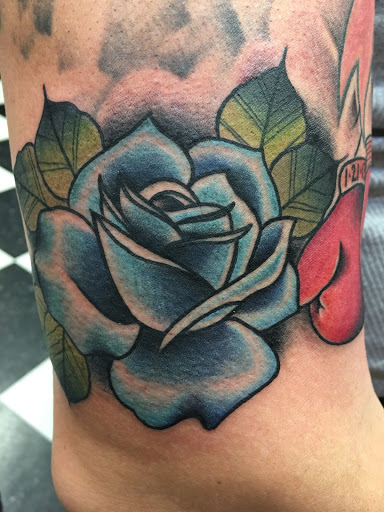 Explore tattoo cover up ideas on leg, creative tattoo ideas in Albany, available at Make Your Mark Tattoo