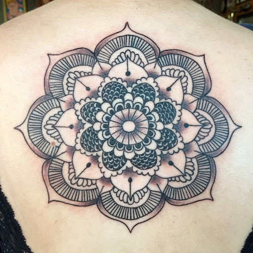 Explore chest plate tattoo ideas, creative tattoo ideas in Reno, available at Aces Tattoo