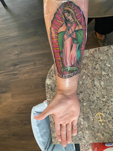 Explore cycle tattoo ideas, creative tattoo ideas in Houston, available at Painstaking Art Tattoo Shop & Piercing