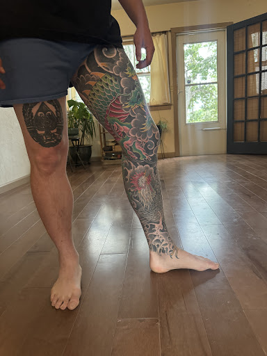 Explore hood neck tattoos ideas, creative tattoo ideas in Austin, available at Black Swan Tattoo Company