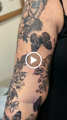 Explore cosmic tattoo ideas, creative tattoo ideas in Cornelia, available at Prismatic Pulse Tattoo