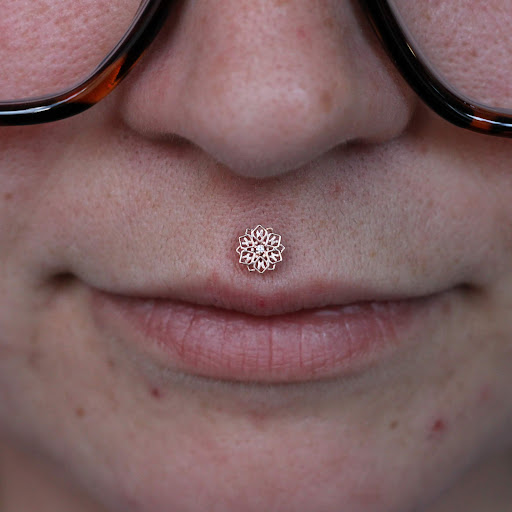 Explore small men's tattoos ideas, creative tattoo ideas in Toledo, available at Piercings by Caitlin presents Holier Toledo