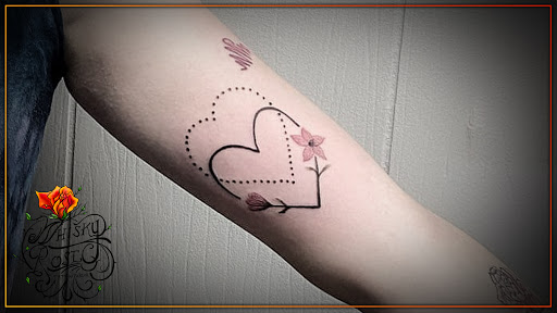 Find tattoo armband ideas for your next unique tattoo in Minocqua at Whisky Rose Tattoo Parlor