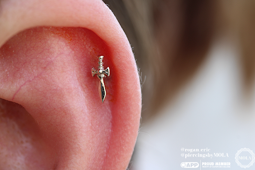 Explore tattoo ideas for football, creative tattoo ideas in Charleston, available at MOLA Piercing and Fine Jewelry