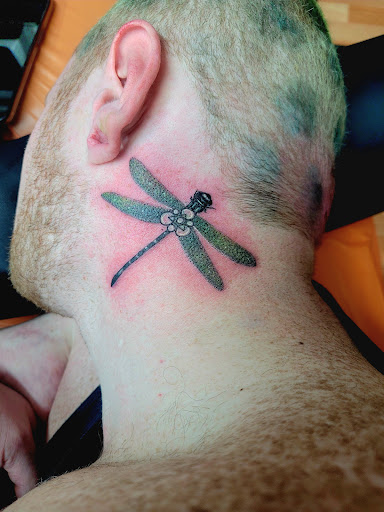 Explore small hand tattoo ideas, creative tattoo ideas in Benton, available at Spectrum Tattoo