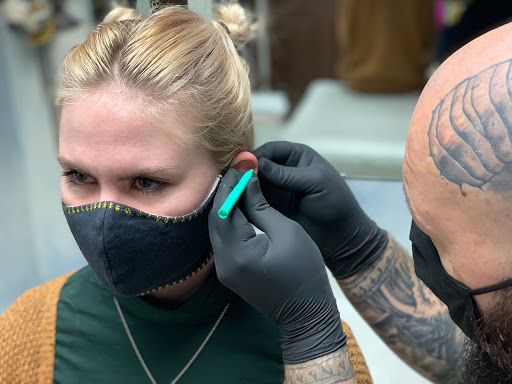 Explore calf tattoo ideas for women, creative tattoo ideas in Orange City, available at Modern Elegance Tattoo & Body Piercing