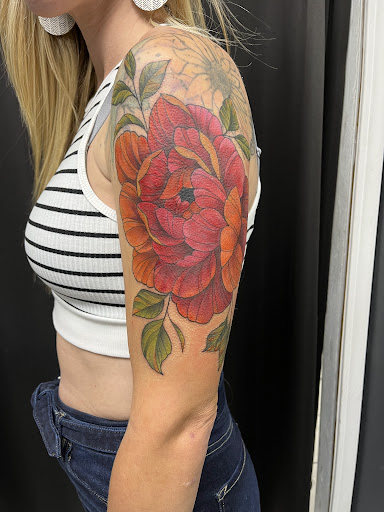 Explore thigh tattoo cover up ideas, creative tattoo ideas in Cadillac, available at Limitless Ink Tattoo Studio