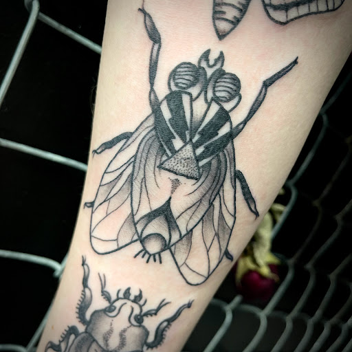 Explore rose tattoo ideas forearm, creative tattoo ideas in Buffalo, available at True Gloom Tattoo Studio