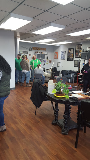 Find small tattoo between breast ideas for your next unique tattoo in Des Moines at All Seeing Eye Tattoo