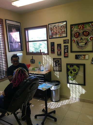 Explore men's inner bicep tattoo ideas, creative tattoo ideas in Brownsville, available at Dark Side of the Moon Tattoos