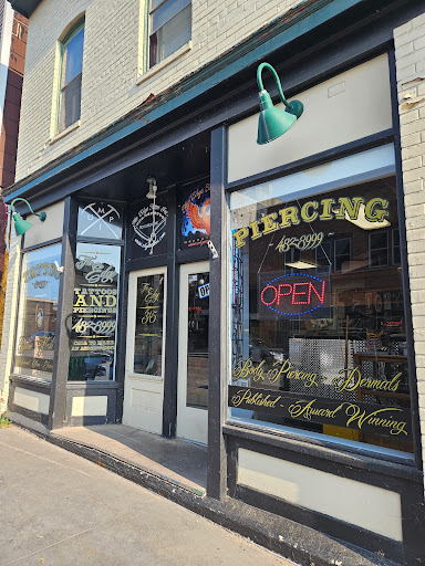 Explore small metal tattoo ideas, creative tattoo ideas in Houghton, available at Edge Tattoo Inc