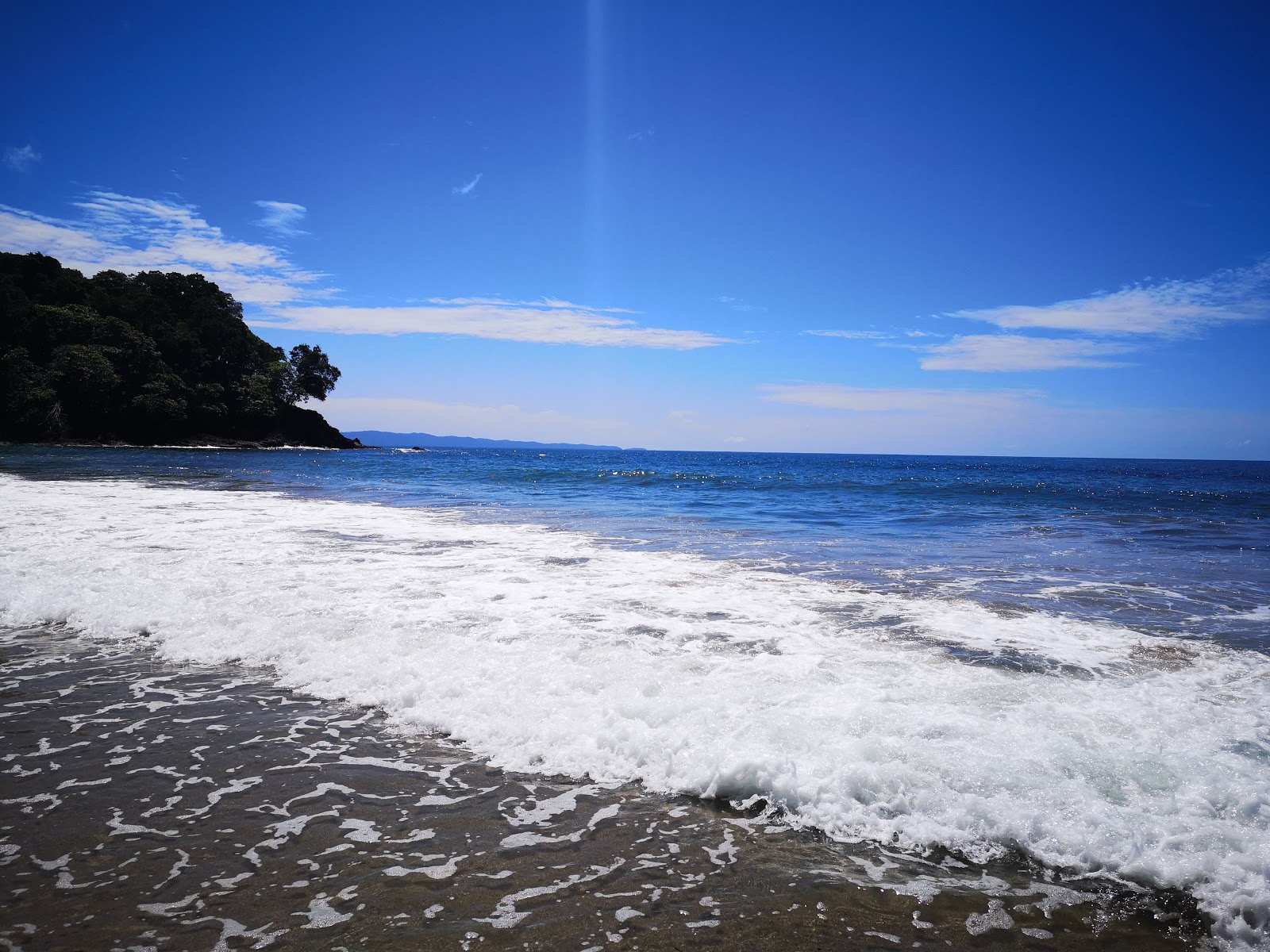 Foto van Playa San Pedrillo met recht en lang