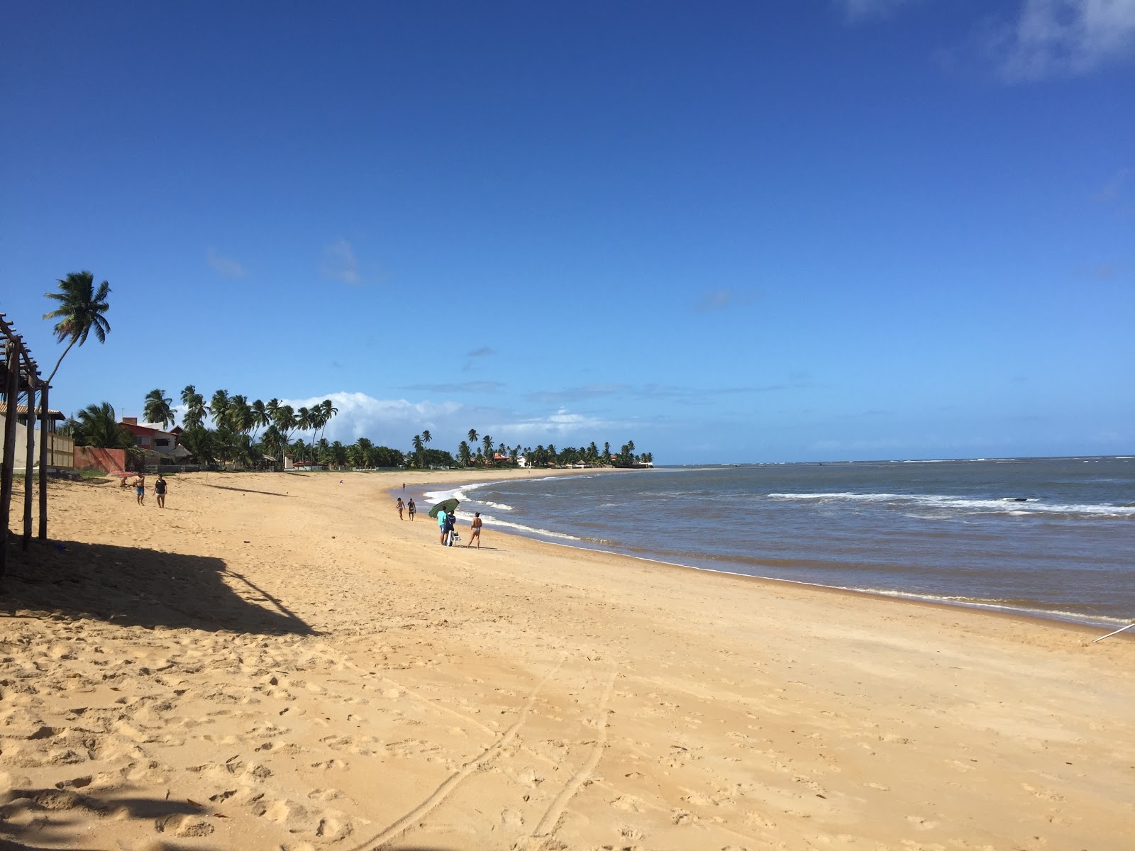 Foto de Praia de Tabuba com areia brilhante superfície
