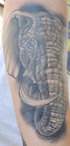 Explore weightlifting tattoos ideas, creative tattoo ideas in Jacksonville, available at Valei Arts Tattoo Studio