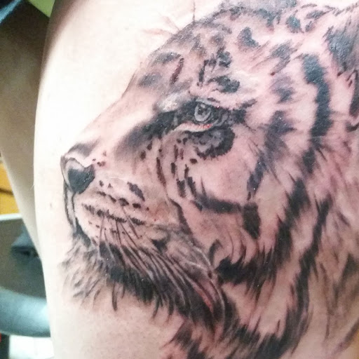 Explore 1975 tattoo ideas, creative tattoo ideas in Longview, available at Fugis Tattoo Shop