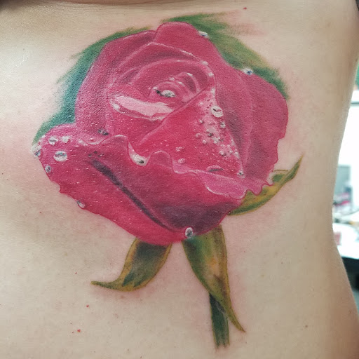 Explore joker hand tattoo ideas, creative tattoo ideas in Redford, available at Empire Tattoo Studio