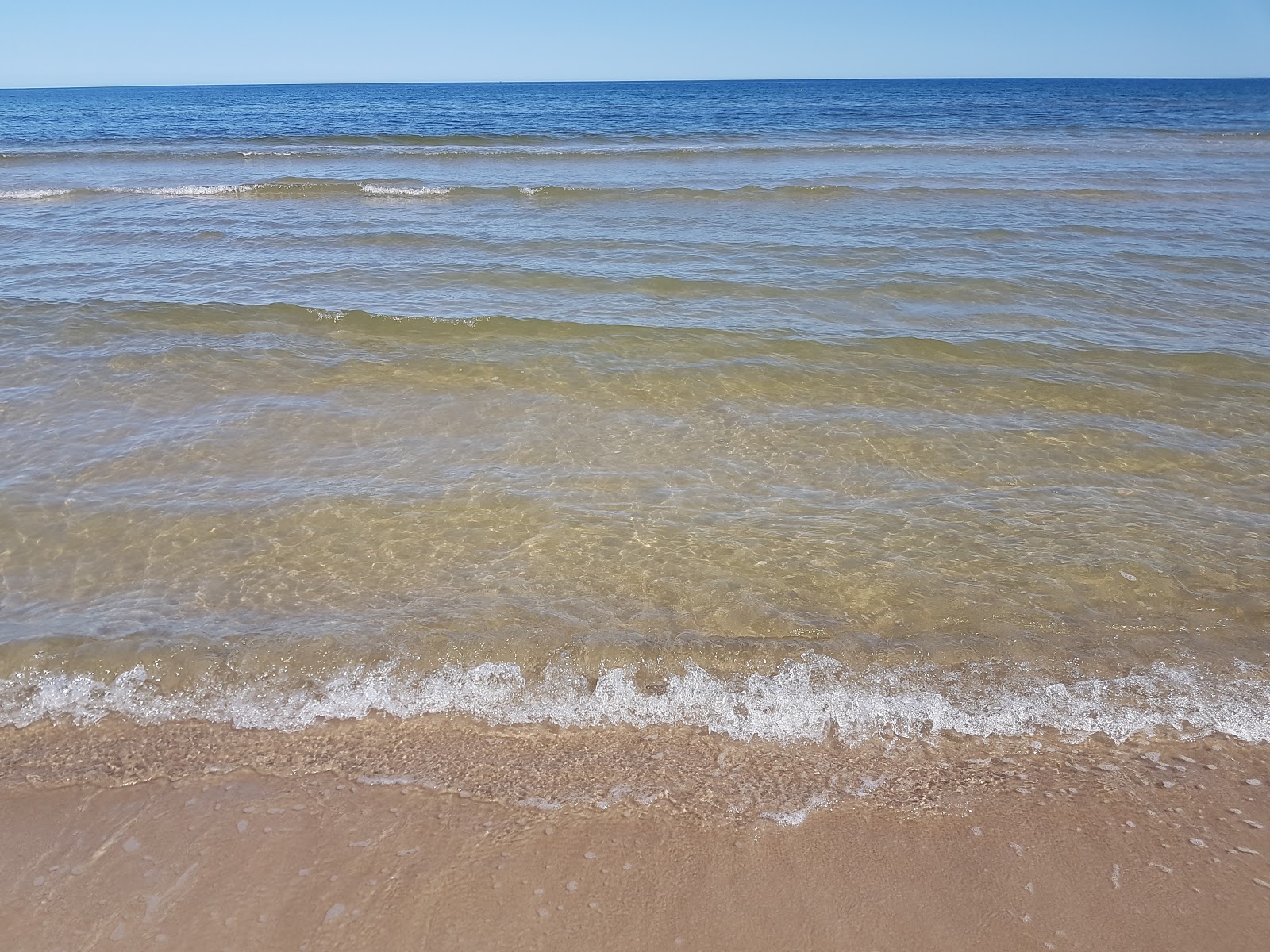 Foto von Grzybowo Baltycka Beach und die siedlung