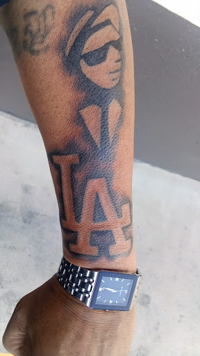 Explore zebra tattoo ideas, creative tattoo ideas in Orange, available at One Drop Tattoo