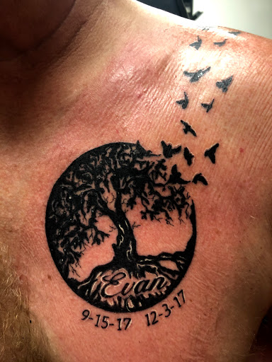 Explore open book tattoo ideas, creative tattoo ideas in Charlottesville, available at Mystic Tattoo and Body Piercing