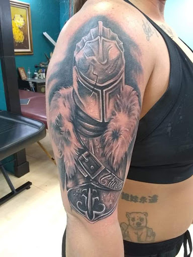 Explore dragon age tattoo ideas, creative tattoo ideas in Hereford, available at Slow Pain Tattoo Body Art Studio