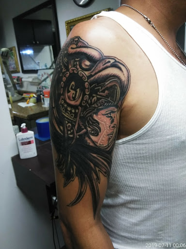 Explore tattoo ideas men upper arm, creative tattoo ideas in Rockford, available at House Of Pain Tattoo co.