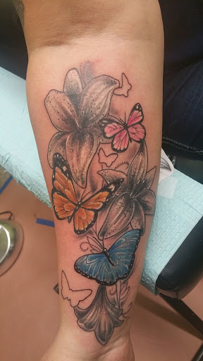 Explore lion and lamb tattoo ideas, creative tattoo ideas in Storm Lake, available at Alley Cat Tattoo
