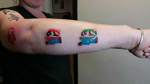 Explore black tattoo ideas for men, creative tattoo ideas in Hilliard, available at 22 Caliber Tattoo Mega Studio