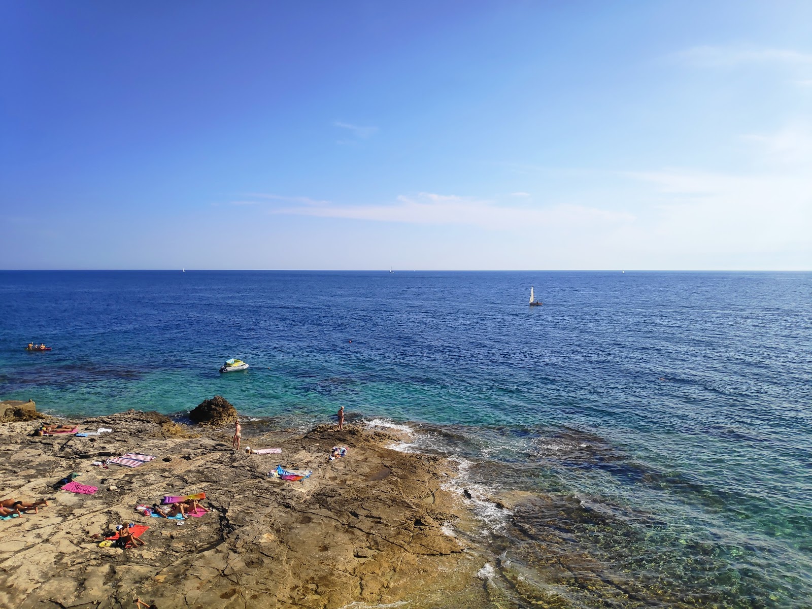 Foto av Lighthouse beach med turkos rent vatten yta