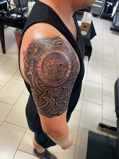 Explore st christopher tattoo ideas, creative tattoo ideas in Sarasota, available at SEVEN SINS Tattoo Studio