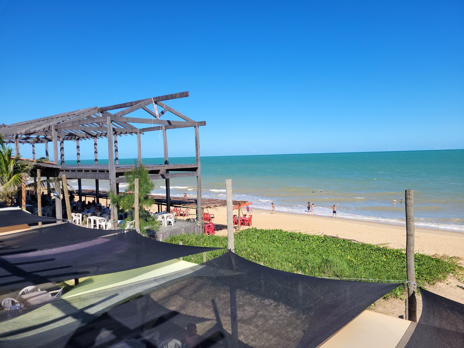 Photo de Plage d'Atlantico avec l'eau cristalline de surface