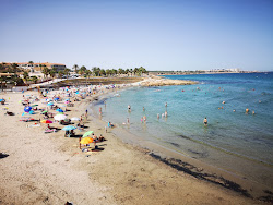 Foto van Flamenca Beach met kleine baai