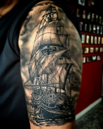 Explore dirtbike tattoo idea, creative tattoo ideas in Kingsford, available at Deft Tattoo Studio