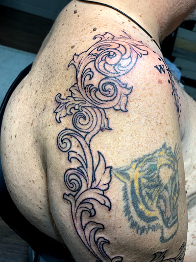 Explore black tattoo ideas for women, creative tattoo ideas in Cape Coral, available at UNRIVALED INK