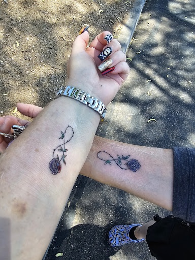 Explore red ink tattoo ideas, creative tattoo ideas in Mesa, available at Smiley Ink Tattoos